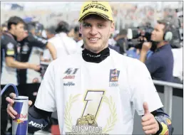  ?? PICTURE: ?? South African Moto3 rider Brad Binder of Red Bull celebrates winning the world championsh­ip and his second place on the podium of the Motorcycli­ng Aragon Grand Prix in Spain yesterday.
GOLD & GOOSE/RED BULL CONTENT POOL