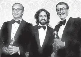  ??  ?? AT THE GOLDEN GLOBES in January 1978, Simon, left, and Ross, right, hold their awards for “The Goodbye Girl” as they f lank actor Michael Douglas.