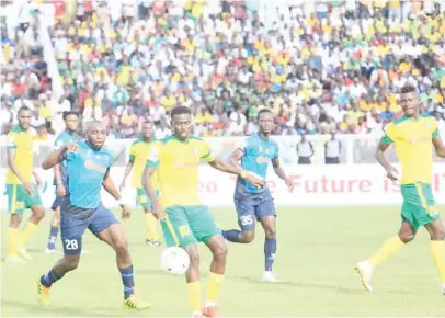  ??  ?? Kano Pillars captain, Rabiu Ali controls the ball under pressure from Niger Tornadoes defender, Gwaza Iorliam in yesterday’s Aiteo Cup final between the two northern clubs at the Ahmadu Bello stadium Kaduna. Pillars won 4-3 on penalties.