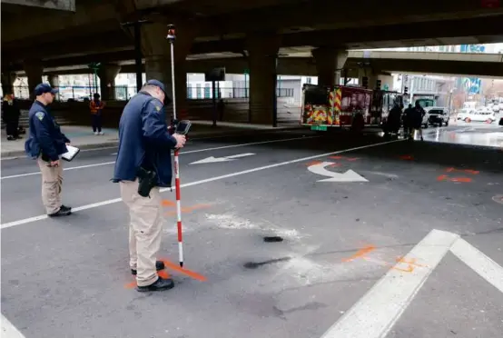  ?? MATTHEW J. LEE/GLOBE STAFF ?? State Police examined where a cement truck struck a person in a wheelchair at Frontage Road and West Fourth Street.