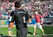  ??  ?? RED
ALERT: A Munster fan confronts Saracens’ Billy Vunipola