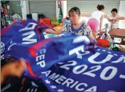 ?? ALY SONG / REUTERS ?? Flags are made for US President Donald Trump’s 2020 re-election campaign in Fuyang, Anhui province, on July 24. Proposed new US tariffs would raise their cost.