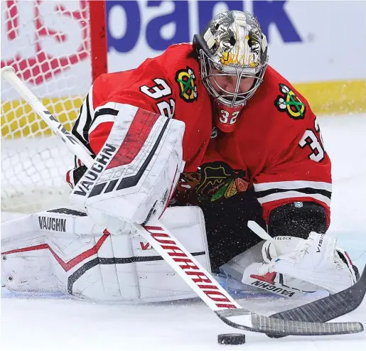  ?? GETTY IMAGES ?? Blackhawks goalie Alex Stalock makes a save during the preseason opener Tuesday against the Blues at the United Center. He allowed three goals on 12 shots.