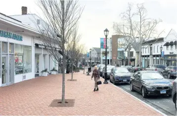  ?? AP ?? The photo shows shops in downtown Westport, Connecticu­t. The boom market in small businesses is showing signs of cooling.