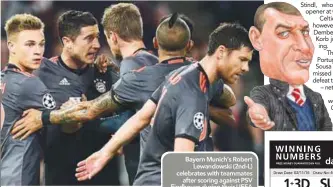  ??  ?? Bayern Munich’s Robert Lewandowsk­i (2nd-L) celebrates with teammates after scoring against PSV Eindhoven during their UEFA Champions League group D match at the Philips Stadium in Eindhoven yesterday. –