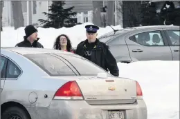  ?? JOE GIBBONS/THE TELEGRAM ?? A friend of Justin Wiseman is taken into police custody around 6:30 p.m. on Tuesday after she left the residence on Jersey Avenue in Mount Pearl.