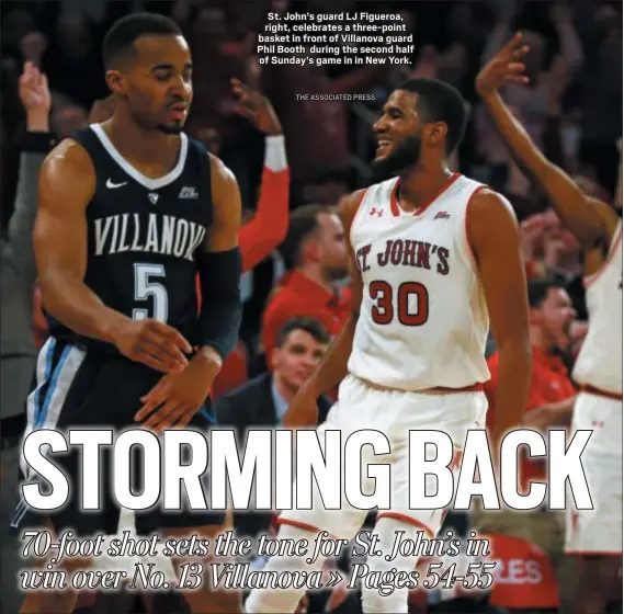  ?? THE ASSOCIATED PRESS ?? St. John’s guard LJ Figueroa, right, celebrates a three-point basket in front of Villanova guard Phil Booth during the second half of Sunday’s game in in New York.