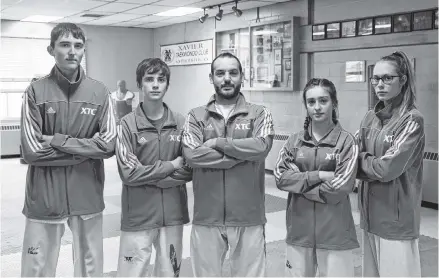 ?? Richard Mackenzie ?? Athletes Ewan Macduff (left), Cole Allen, Leah Grant and Rebekah Pitts, from Antigonish-based Xavier Taekwondo, are ready to compete in a national competitio­n Jan. 10 to 12 in Quebec City. Instructor Jeremy Reeve, in centre of photo, noted how the four prepared by attending a competitio­n in Michigan at the start of December.