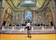  ?? ANTONIO CALANNI/AP 2017 ?? A woman plays tennis last year as part of an installati­on of American artist Asad Raza, set in the 16th-century San Paolo Converso deconsecra­ted church in Milan, Italy.