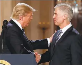  ?? Carolyn Kaster Associated Press ?? PRESIDENT TRUMP announces Neil M. Gorsuch as his Supreme Court nominee in 2017. Gorsuch has written a new book, “A Republic, If You Can Keep It.”