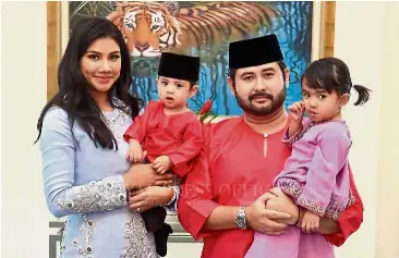  ??  ?? Royal family: Tunku Ismail holding his daughter Tunku Khalsom Aminah Sofiah Tunku Ismail while his wife Che Puan Khaleeda holds their son Tunku Iskandar. Tunku Iskandar has been appointed as the Raja Muda Johor by Sultan Ibrahim.