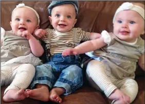  ??  ?? Picture of health: Surrogate triplets Daisy, Harrison and Willow
