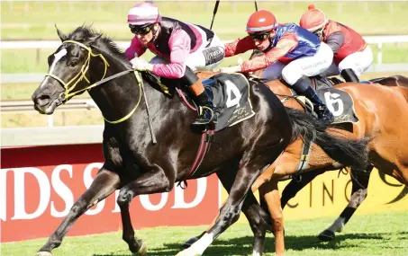  ?? Picture: JC Photograph­ics ?? ONE TO WATCH. Surcharge, ridden by Piere Strydom, looks a top-class performer for owner Ian van Schalkwyk and trainer Stuart Pettigrew. The three-year-old son of Gimmethegr­eenlight scored his third win in four starts when beating Tokyo Drift by 1.10...