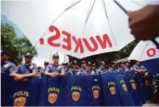  ?? AP ?? Protesters demonstrat­e outside the nuclear power conference in Manila, Philippine­s, yesterday.