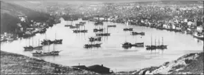  ?? — Photo from the archives of Jean Pierre Andrieux ?? Vessels of the Portuguese White Fleet take refuge from a hurricane in St. John’s harbour in this undated photo.