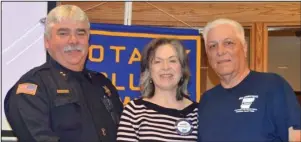  ?? Submitted photo ?? GRANTS: From left, Hot Springs Village Police Chief Ricky Middleton, Rotarian Melanie Pederson, and Jim Patton of the HSV Citizens Police Academy Alumni Associatio­n receive a Rotary grant in “pre-COVID days.”