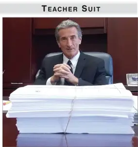  ?? RECORDER PHOTO BY RICK ELKINS ?? TEACHER SUIT Portervill­e Unified School Superinten­dent Ken Gibbs sits behind the stack of paper which is the lawsuit in which PUSD is named by teachers against the California Teachers Associatio­n over union dues. At left is the suit filing including...