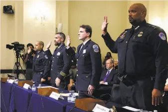  ?? Jim Lo Scalzo / Associated Press ?? From left: U.S. Capitol and Washington Metropolit­an Police officers Aquilino Gonell, Michael Fanone, Daniel Hodges and Harry Dunn are sworn in to testify to the House select committee.