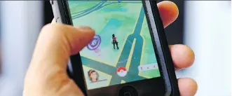  ?? THE ASSOCIATED PRESS/ FILES ?? A player displays Pokemon Go on a cellphone. Alberta Health Services is asking game players “to leave the Pokemons in our facilities for young patients to catch.”