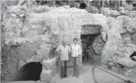  ?? PHOTOS BY MAYA ALLERUZZO AP ?? Hebrew University archaeolog­ists Dr. Oren Gutfeld, left, and Michal Habe, at the site of a Jewish ritual bath, or mikveh, in the Old City of Jerusalem.