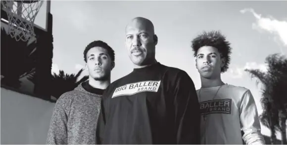  ??  ?? LaVar Ball poses with two of his three sons: Chino Hills (Calif.) High School basketball stars LiAngelo, left, and LaMelo. LiAngelo will play for UCLA next season. LaMelo scored 92 points in a game this season as a 15-year-old sophomore. The other Ball...