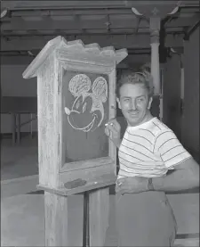  ?? AP PHOTO, FILE ?? Walt Disney, creator of Mickey Mouse, poses for a photo at the Pancoast Hotel, Aug. 13, 1941, in Miami, Fla.