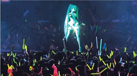  ?? CAPTURA DE PANTALLA ?? En los ‘shows’ de Hatsune Miku, las personas pueden comprar tubos de colores para animar el espectácul­o, mientras la estrella virtual canta.