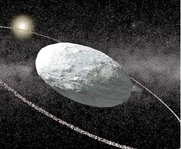  ?? — AFP photo ?? This handout photo released by Nature shows an artistic view of Haumea and its ring system with correct proportion­s for the main body and the ring.