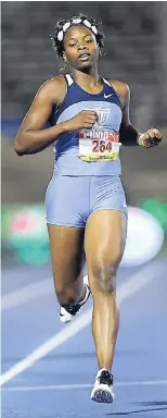  ?? RICARDO MAKYN/MULTIMEDIA PHOTO EDITOR ?? Kevona Davis, 23.92 seconds, wins her heat in the girls Class Two 200m at the ISSA-GraceKenne­dy Boys and Girls’ Athletics Championsh­ips at the National Stadium yesterday.