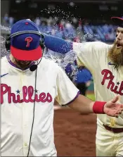  ?? MATT ROURKE/AP ?? Boys! Boys! Play nice, now, OK? Brandon Marsh dumps water on Whit Merrifield after the Phillies beat the Giants on Monday in the City of Brotherly Love, continuing their hot streak a dunking isn’t likely to cool off.