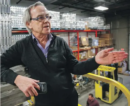  ?? JEFF MCINTOSH ?? President Peter Love of Cask Global Canning Solutions, looking out over his factory in Calgary, says his ‘micro-canning’ machines for micro-breweries have been installed in 725 locations in 44 countries since 2002. He’s considerin­g branching out to...