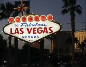  ?? JOHN LOCHER ?? FILE - In this Sept. 21, 2018, file photo, the Mandalay Bay hotel and casino reflects the last sunlight of the day along the Las Vegas Strip in Nevada. The family of a woman killed by a gunman raining down gunfire from the Las Vegas high-rise hotel suite filed a wrongful death lawsuit Tuesday, July 2, 2019, against eight gun makers and three dealers arguing their weapons are designed in a way that could be easily modified to fire like automatic weapons. The lawsuit, which targets Colt and seven other gun manufactur­ers, along with gun shops in Nevada and Utah, is the latest case to challenge a federal law shielding gun manufactur­ers from liability.