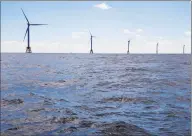  ?? Eric Thayer / Bloomberg ?? The GE-Alstom Block Island Wind Farm stands in the water off Block Island, R.I.