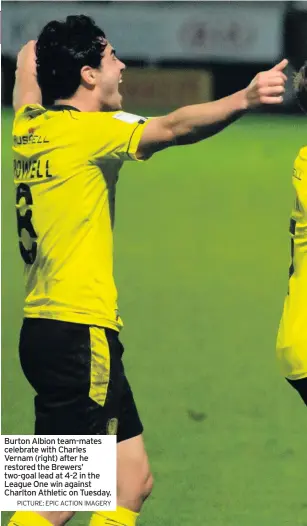  ?? PICTURE: EPIC ACTION IMAGERY ?? Burton Albion team-mates celebrate with Charles Vernam (right) after he restored the Brewers’ two-goal lead at 4-2 in the League One win against Charlton Athletic on Tuesday.