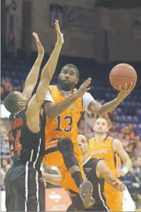  ?? JASON MALLOY/TC MEDIA ?? Island Storm guard Terry Thomas, right, drives into the paint for a shot Friday while being defended by Orangevill­e’s Rahlir Hollis-Jefferson.