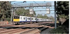  ?? ANTONY GUPPY. ?? MTR Crossrail 315828 leads the 1434 Shenfield-London Liverpool Street at Romford Junction on October 12 2015. The Class 315 fleet used by MTR Crossrail is performing around twice as reliably than it did when used by Abellio Greater Anglia.