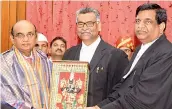  ?? — DC ?? Chief Justice Thottathil B Radhakrish­nan (centre) felicitate­s retiring Justice C.V. Nagarjuna Reddy (left) at the High Court premises on Tuesday.