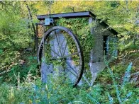  ?? Photo by Corbet Deary of The Sentinel-record ?? ■ The section of the Sunset Trail from Gulpha Gorge Campground to Ricks Pond makes its way alongside an old mill near the trek's end.