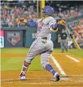  ?? LAURENCE KESTERSON/THE ASSOCIATED PRESS ?? The New York Mets’ Yoenis Cespedes follows through on his third home run during Tuesday’s game against the Phillies in Philadelph­ia.