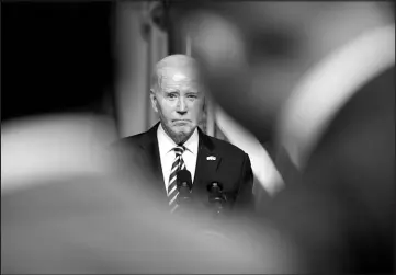  ?? ANDREW HARNIK / ASSOCIATED PRESS (2023) ?? President Joe Biden listens to a question from a reporter during a news conference with Ukrainian President Volodymyr Zelenskyy on Dec. 12 at the White House.