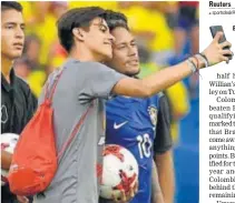 ?? AFP ?? Neymar (in blue) poses for a selfie after the Colombia match.