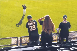  ?? Scott Strazzante / The Chronicle ?? Right fielder Matt Joyce salutes fans in the bleachers at the Coliseum on Monday night. The A’s drew an announced crowd of 9,736, which saw Oakland fall 3-2 to Tampa Bay.