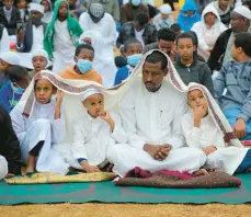  ?? SAYYID ABDUL AZIM/AP ?? Muslims in Nairobi, Kenya, gather Saturday for prayers to celebrate Eid al-Adha, a major festival that commemorat­es the faith of the Prophet Ibrahim.