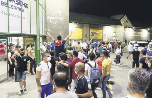  ??  ?? People gather to send off a conscript at a bus station in the İzmit district of Kocaeli, Turkey, June 30, 2020.