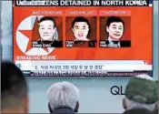  ?? AHN YOUNG-JOON/AP ?? South Koreans in Seoul view a recent TV report about the detainees: Kim Dong Chul, Tony Kim and Kim Hak Song.