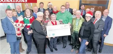  ??  ?? Perfect present Provost Jean Jones (front, left) with councillor­s and senior managers present the £250 donation, split between St Andrew’s and Strathcarr­on hospices