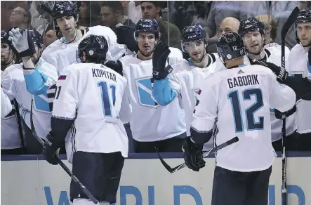  ?? BRUCE BENNETT/GETTY IMAGES ?? Marian Gaborik of Team Europe is congratula­ted by his teammates after scoring a second-period goal against Sweden during Europe’s 3-2 win in the semifinal on Sunday in Toronto.