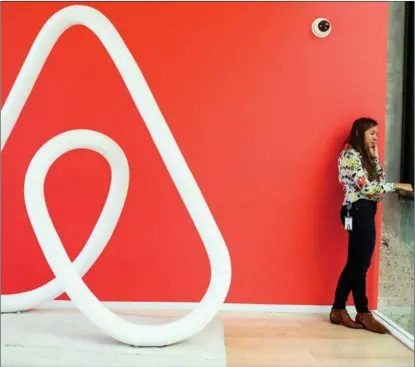  ?? REUTERS ?? An employee talks on the phone at Airbnb’s headquarte­rs in San Francisco, the United States.