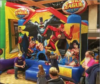  ?? PAUL POST — PPOST@DIGITALFIR­STMEDIA.COM ?? A Justice League bounce house gave kids a chance to have fun with their favorite superheroe­s.