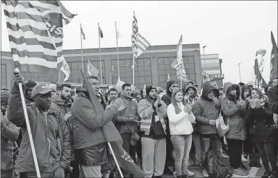  ?? [PIERO PAOLO FERRERI/ANSA] ?? Workers stage a protest in front of an Amazon logistic center in Castel San Giovanni, near Piacenza, northern Italy on Friday.